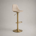Sgabello da bar regolabile 65-85 cm con seduta imbottita beige in PU e struttura in acciaio dorato con base circolare e poggiapiedi